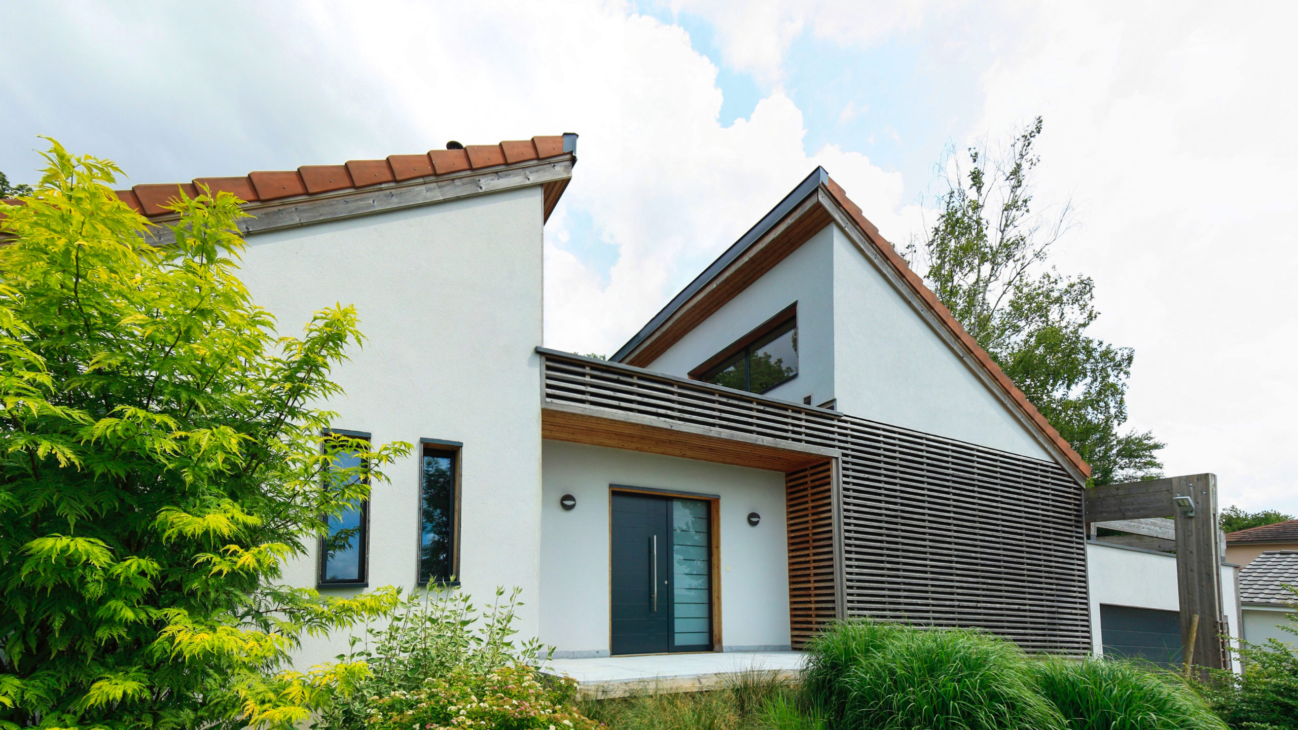 Maisons et chalets bois GICO Constructions Vosges - Maison osstaure bois bardage blanc